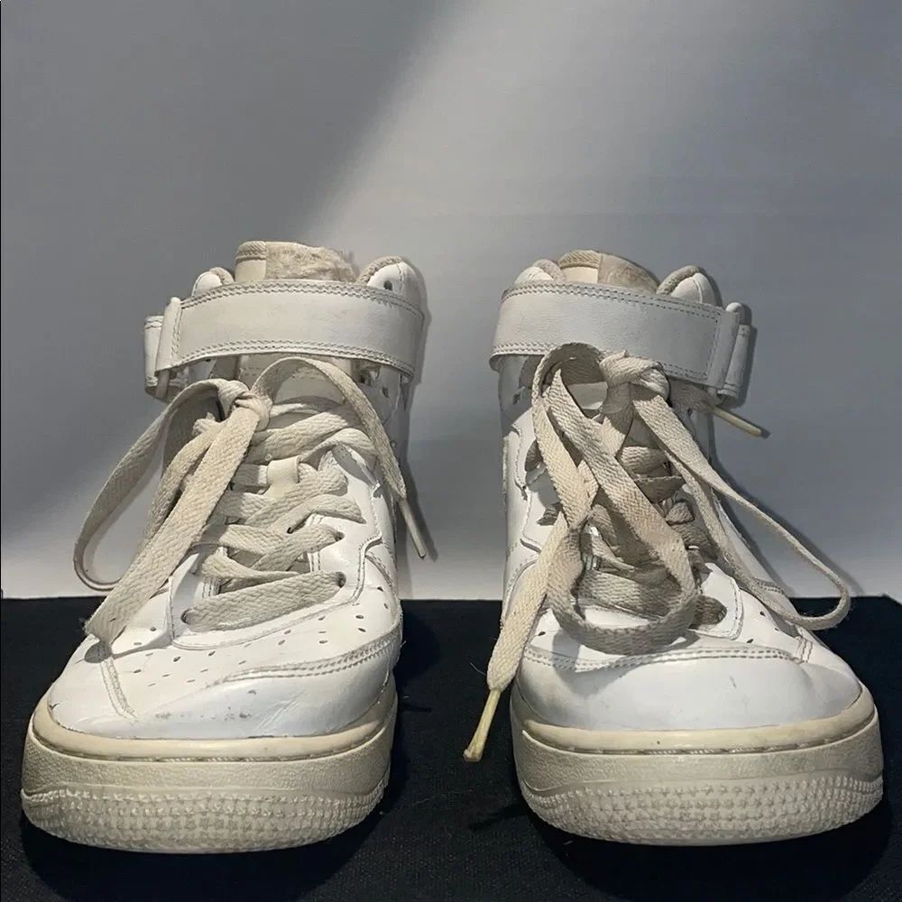 Nike White Sneakers with High-Top Design and Vintage Sole